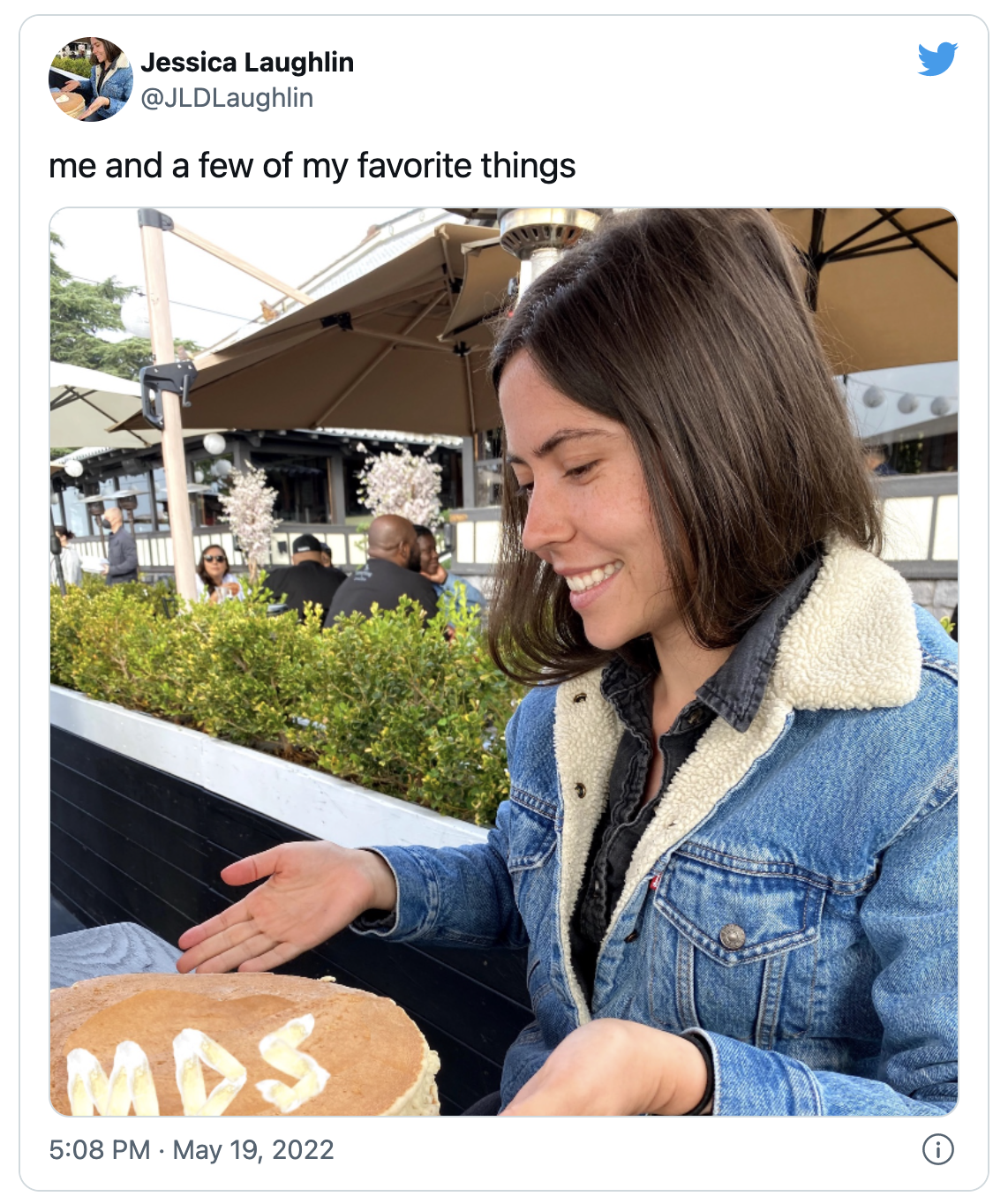 A tweet that reads: "me and a few of my favorite things" and then shows a picture of a woman with a stack of pancakes that has the letters "MDS" written on them.